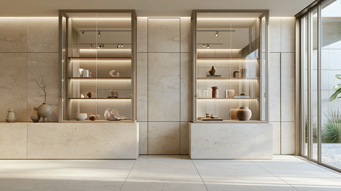 A warm white sintered stone museum-style vitrine, shown as a wide room view