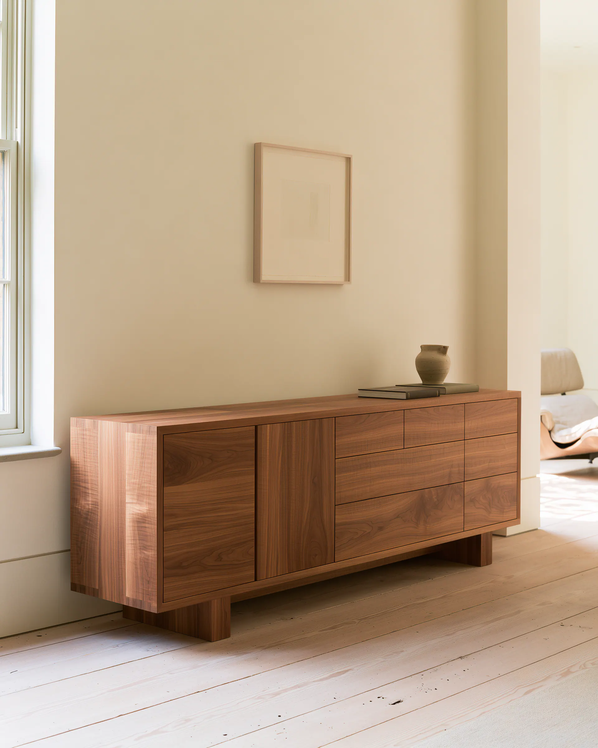 Dark walnut living room sideboard with continuous grain and a low furniture profile